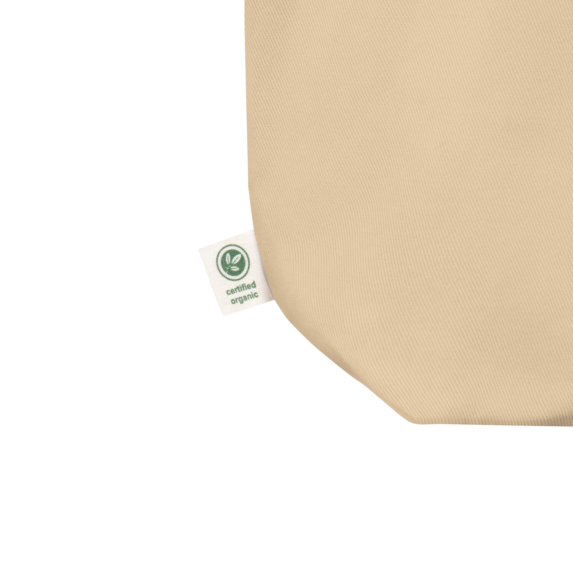 Cornerstone Wear beige tote bag label close up.