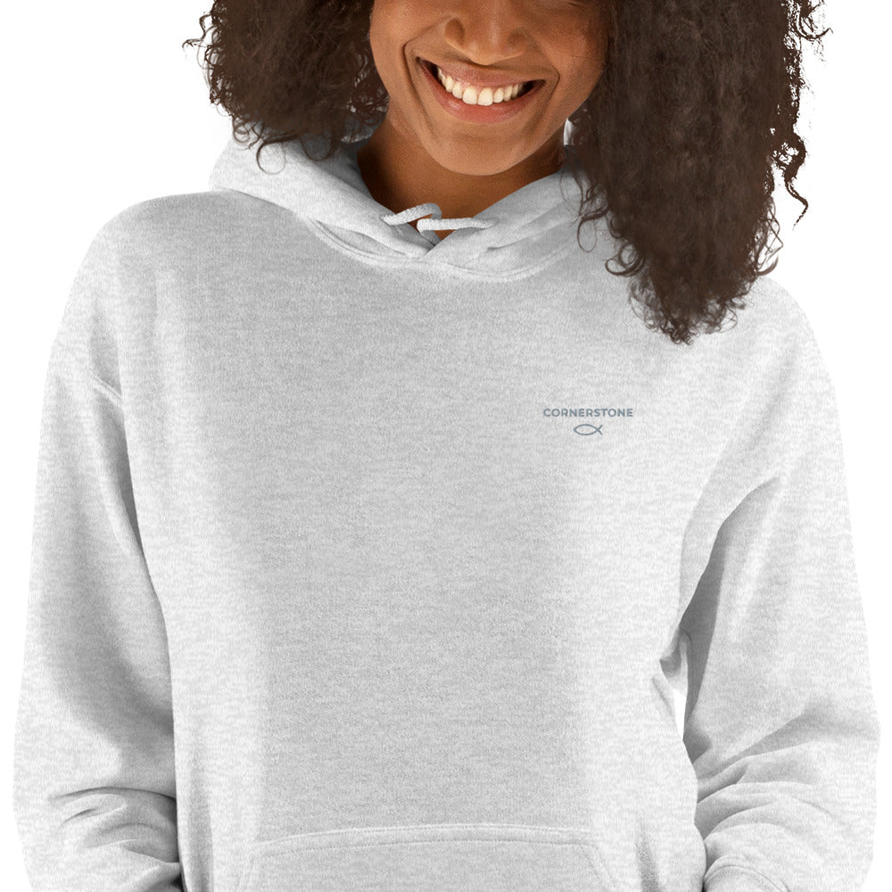 Cornerstone Wear unisex grey hoodie worn by woman, front view showing chest logo.
